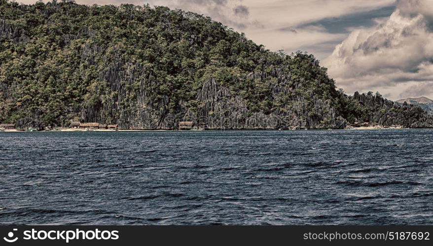 from a boat in philippines snake island near el nido palawan beautiful panorama coastline sea and rock