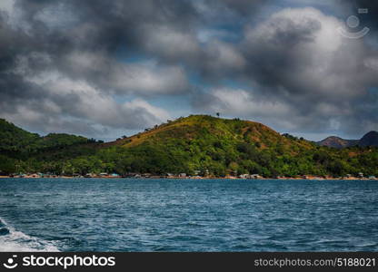 from a boat in philippines snake island near el nido palawan beautiful panorama coastline sea and rock