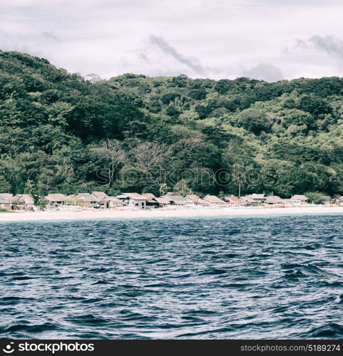 from a boat in philippines snake island near el nido palawan beautiful panorama coastline sea and rock