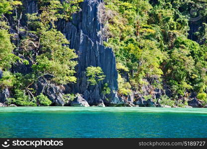 from a boat in philippines snake island near el nido palawan beautiful panorama coastline sea and rock