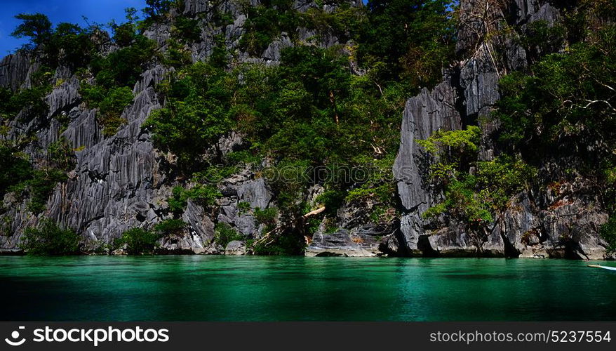 from a boat in philippines snake island near el nido palawan beautiful panorama coastline sea and rock