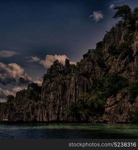 from a boat in philippines snake island near el nido palawan beautiful panorama coastline sea and rock