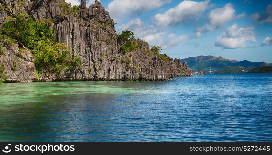 from a boat in philippines snake island near el nido palawan beautiful panorama coastline sea and rock