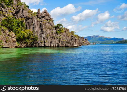 from a boat in philippines snake island near el nido palawan beautiful panorama coastline sea and rock