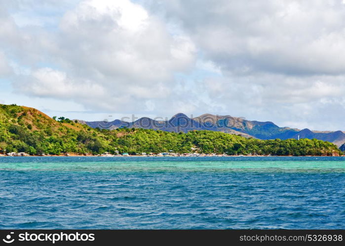 from a boat in philippines snake island near el nido palawan beautiful panorama coastline sea and rock