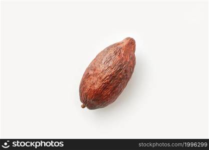 From above of single whole raw pod of Theobroma cacao tree on white background. Textured whole pod of cacao tree