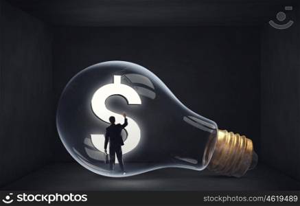 From inside of idea. Man holding luminous idea inside light bulb