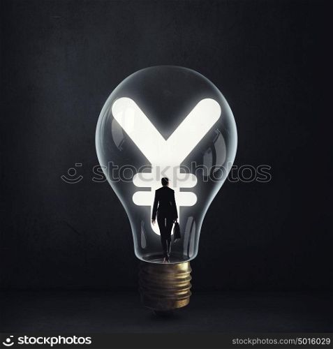 From inside of idea. Woman holding luminous idea inside light bulb