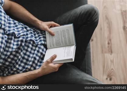 from man reading couch