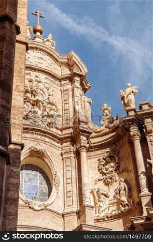 Front entrance facade of Torre del Micalet at Valencia cathedral. Famous attraction in old town area. Spain.