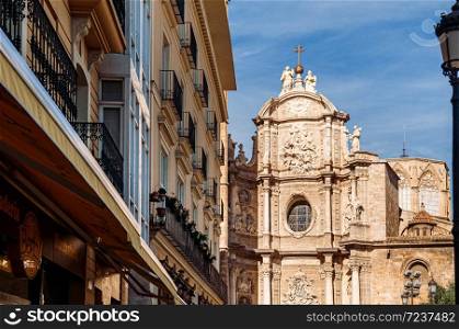 Front entrance facade of Torre del Micalet at Valencia cathedral. Famous attraction in old town area. Spain.
