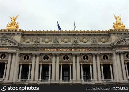 Front Facade of Opera National de Paris. Grand Opera (Garnier Palace) is famous neo-baroque building in Paris, France - UNESCO World Heritage Site.