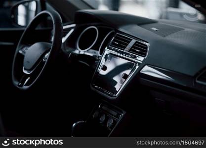 Front part of brand new automobile. Modern black interior. Conception of vehicles.. Front part of brand new automobile. Modern black interior. Conception of vehicles