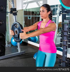 front plate raise brunette girl workout at gym exercise