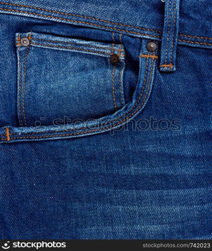 front pocket of blue classic jeans, full frame, close up
