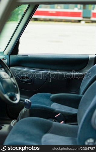 Front seats inside car. Two chairs drivng wheel in vehicle. . Front seats inside car. 