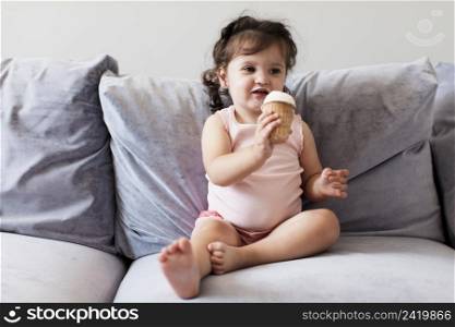 front view adorable young girl sofa