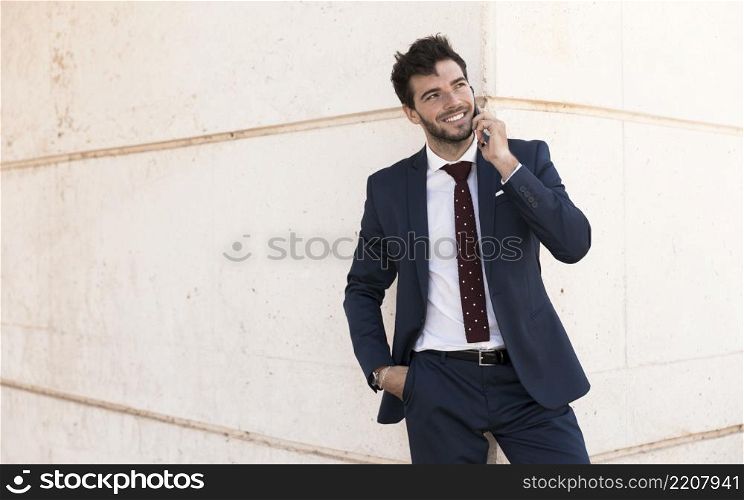 front view adult suit talking phone