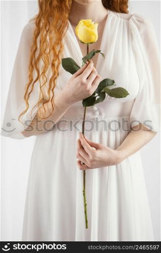 front view alluring woman posing with spring flower 2
