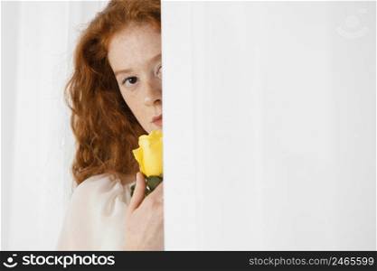 front view alluring woman posing with spring flower copy space