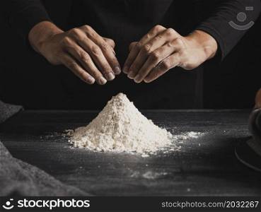 front view baker hands mixing flour
