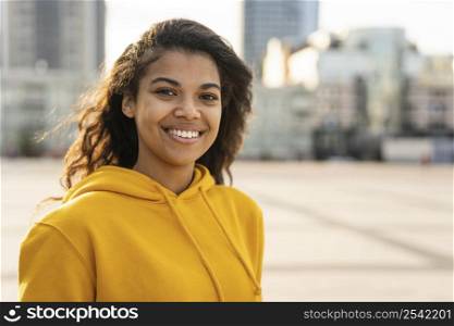 front view beautiful girl with yellow hoodie