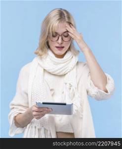 front view blonde woman holding tablet