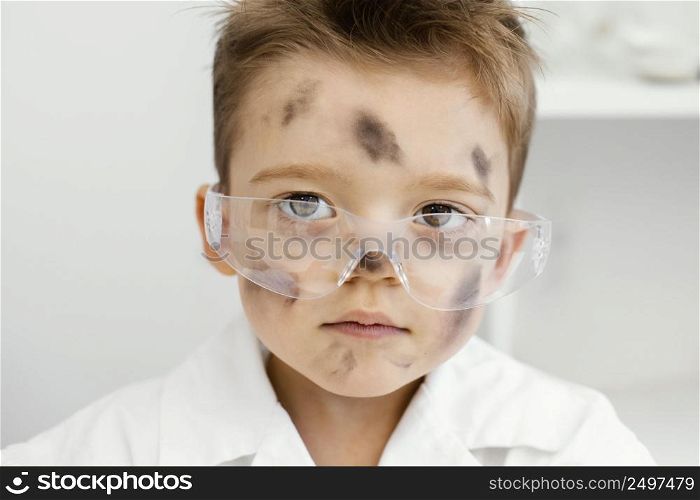 front view boy scientists laboratory with safety glasses failed experiment