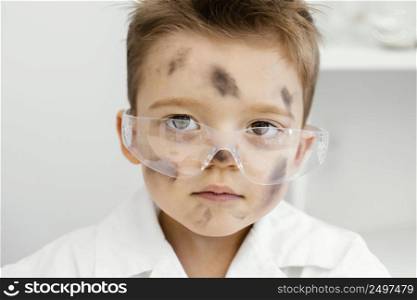 front view boy scientists laboratory with safety glasses failed experiment