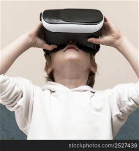 front view boy using virtual reality headset