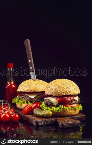 front view burgers cutting board. Resolution and high quality beautiful photo. front view burgers cutting board. High quality beautiful photo concept