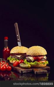 front view burgers cutting board. Resolution and high quality beautiful photo. front view burgers cutting board. High quality beautiful photo concept