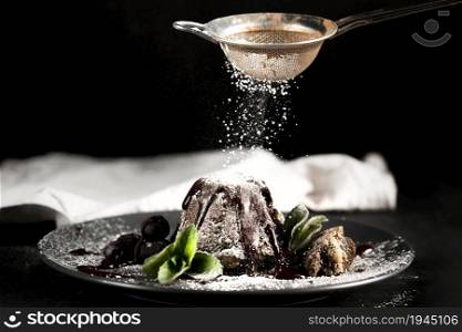 front view chocolate cake with powdered sugar. High resolution photo. front view chocolate cake with powdered sugar. High quality photo