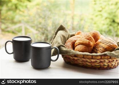 front view coffee cups with croissants