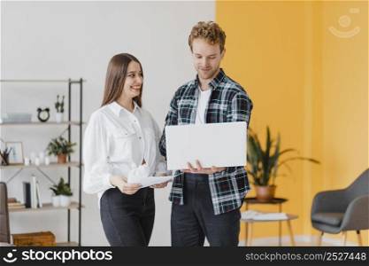 front view couple planning together redecorate household