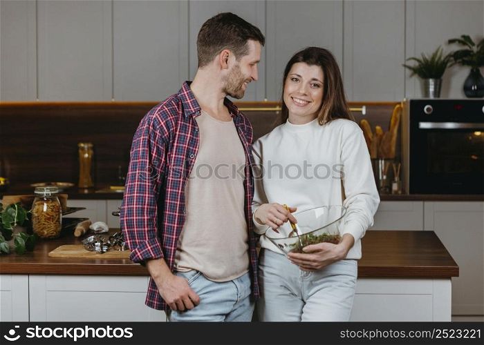 front view couple preparing food home