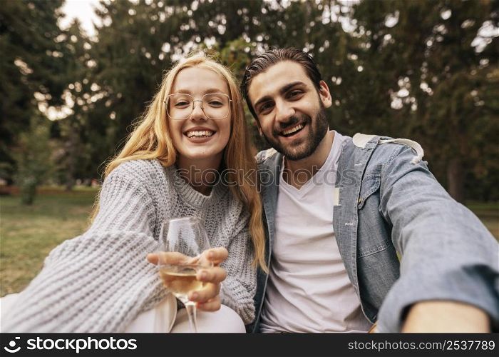 front view couple taking selfie