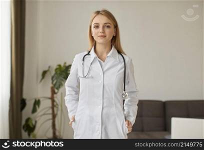 front view covid recovery center female doctor with posing with stethoscope