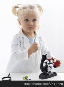 front view cute toddler with lab coat microscope