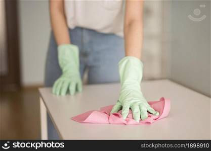 front view defocused woman cleaning surface. Resolution and high quality beautiful photo. front view defocused woman cleaning surface. High quality beautiful photo concept