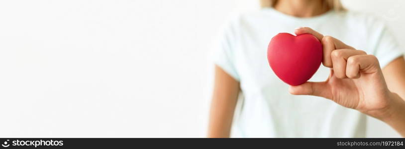 front view defocused woman holding heart shape. High resolution photo. front view defocused woman holding heart shape. High quality photo