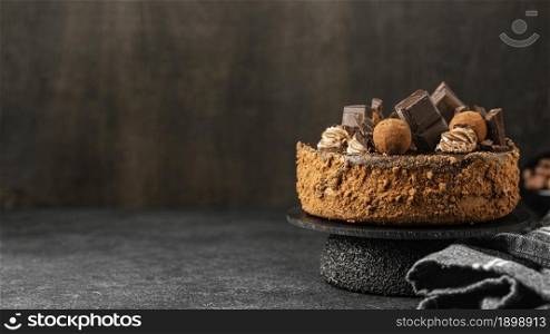 front view delicious chocolate cake stand with copy space. Resolution and high quality beautiful photo. front view delicious chocolate cake stand with copy space. High quality beautiful photo concept