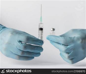 front view doctor putting vaccine syringe
