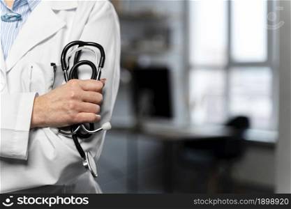 front view female doctor holding stethoscope with copy space. Resolution and high quality beautiful photo. front view female doctor holding stethoscope with copy space. High quality beautiful photo concept