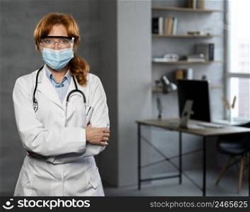 front view female doctor with medical mask copy space