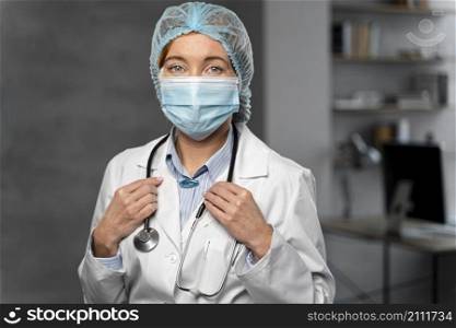 front view female doctor with stethoscope hairnet