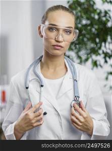 front view female researcher with stethoscope