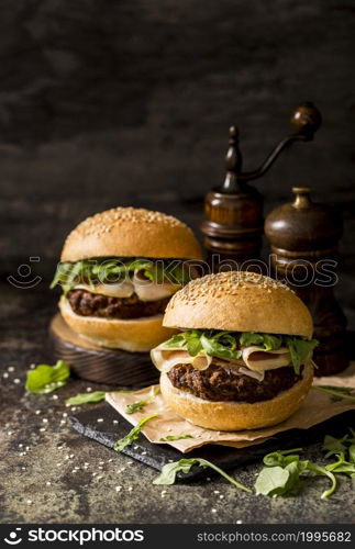 front view fresh beef burgers with bacon slate board 1