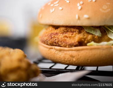 front view fried chicken burger with salad sesame seeds