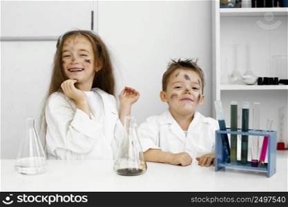 front view girl boy scientists laboratory with test tubes failed experiment